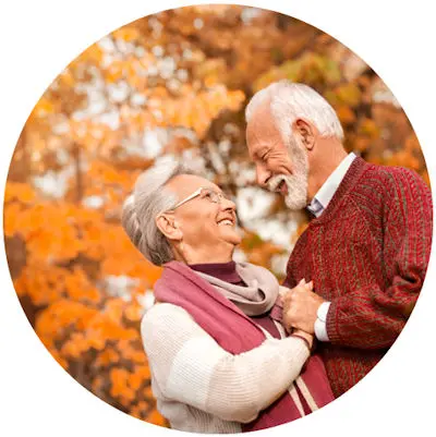 Old couple in fall trees
