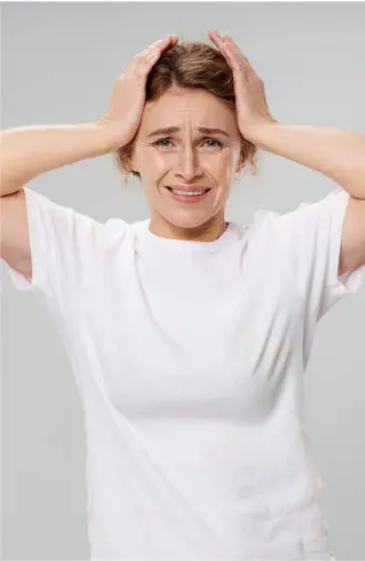 Woman with head in her hands