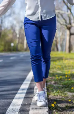 person balancing on kerb