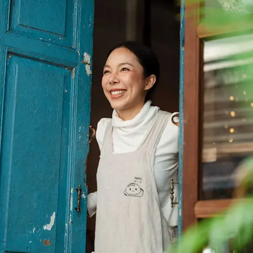 Woman in doorway smiling