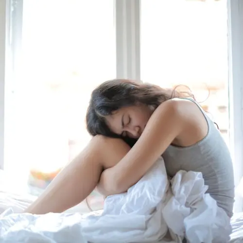 Depressed woman in bed